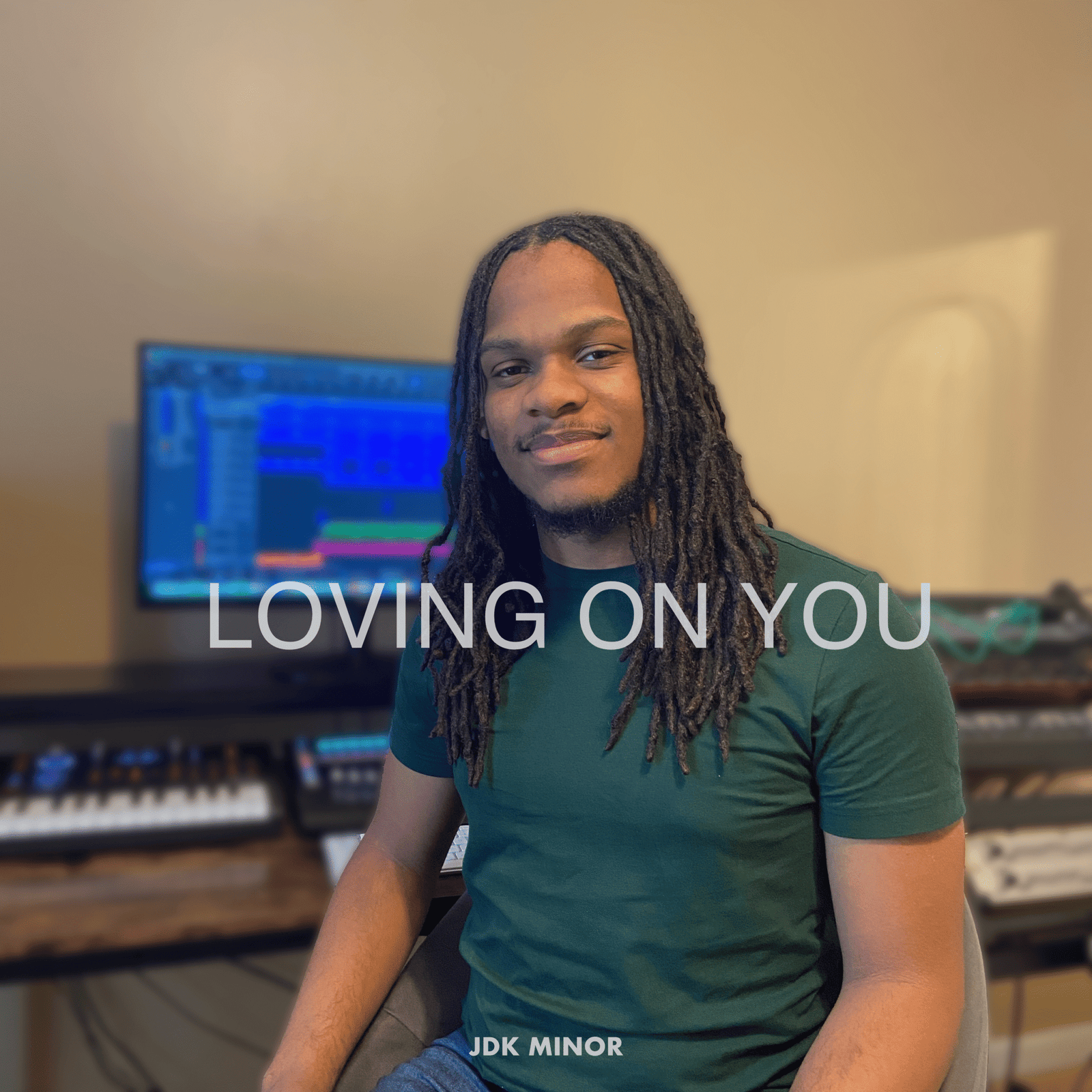 JDK Minor posing for the cover art of the song "Loving on You"